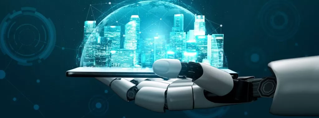 Mão robótica segurando um tablet com uma cidade digital holográfica. O artigo explora o papel da Inteligência Artificial na Indústria 4.0.